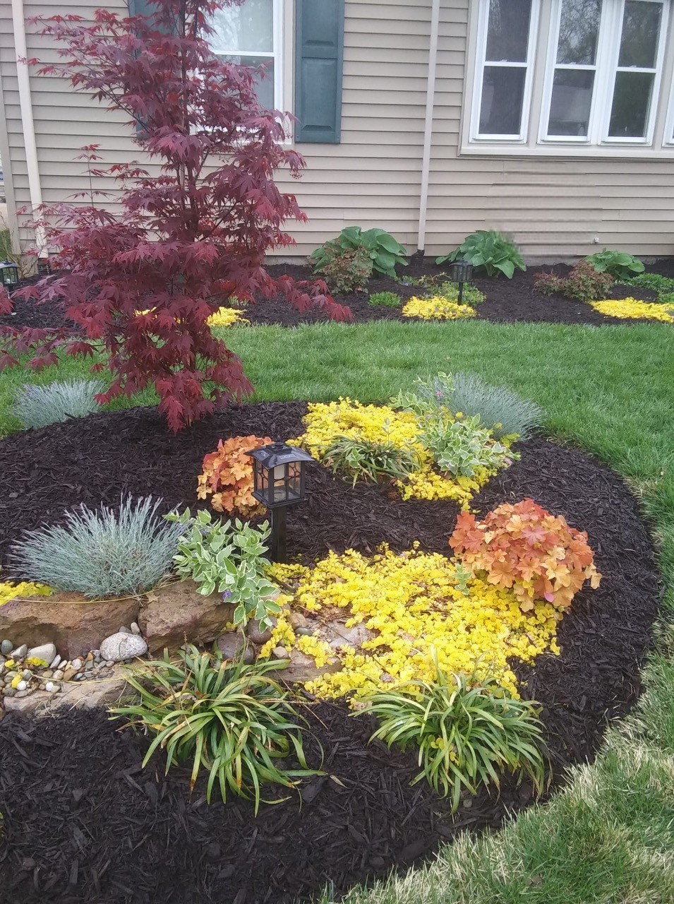 how to keep weeds out of mulched flower beds