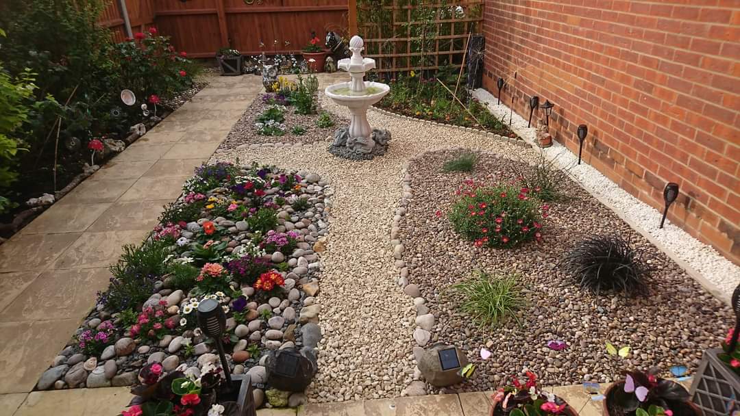 river rock backyard designs